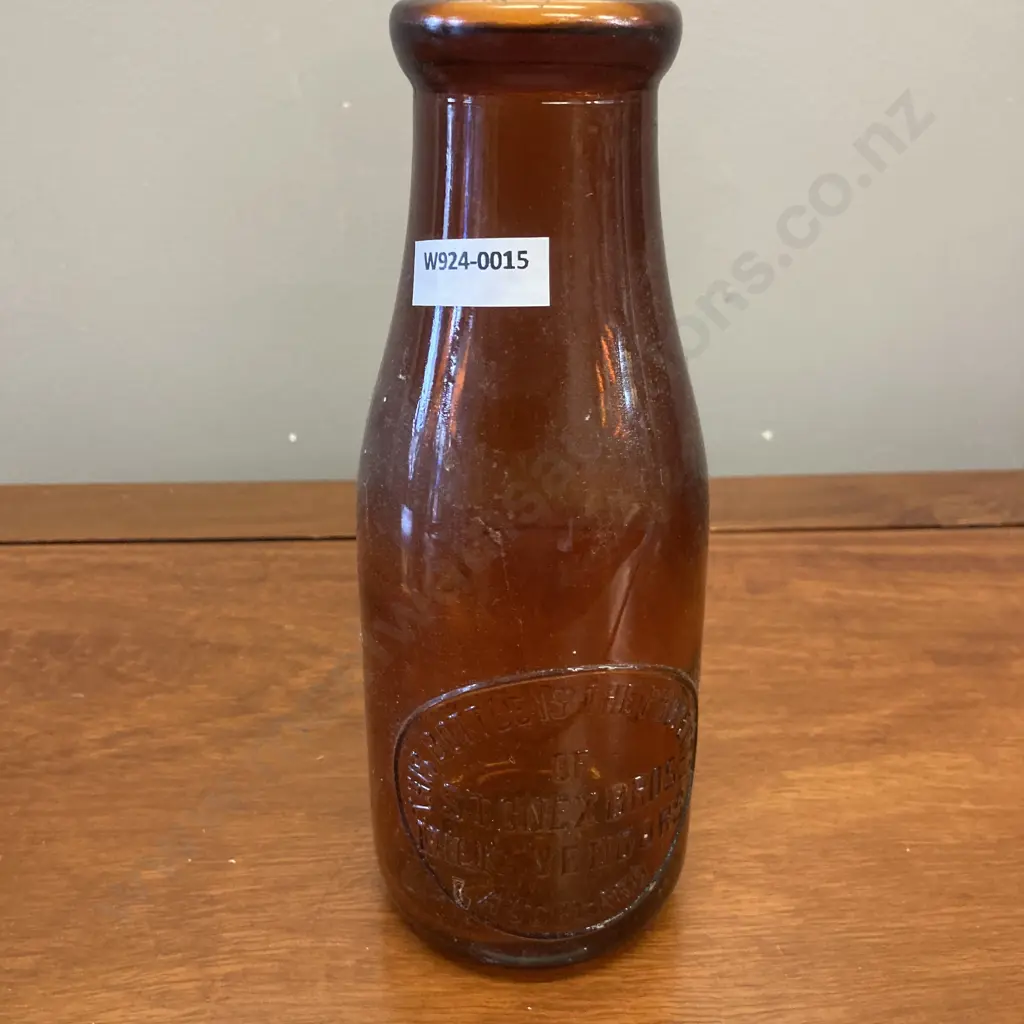 Stonex Bros Milk Vendors Auckland Amber Glass One Imperial Pint Bottle, 1950s. H21cm Image 1++